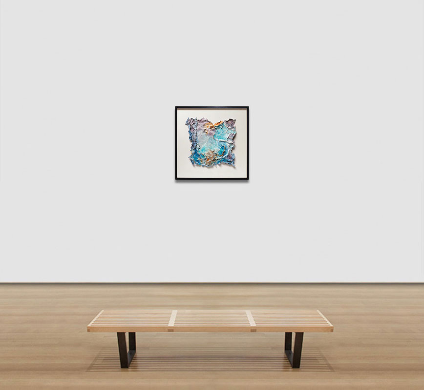View in a room of an abstract textural work on paper tridimentionally cast by the artist. Mainly turquoise and orange colors. Title: Aurora Vernum (Spring Dawn)