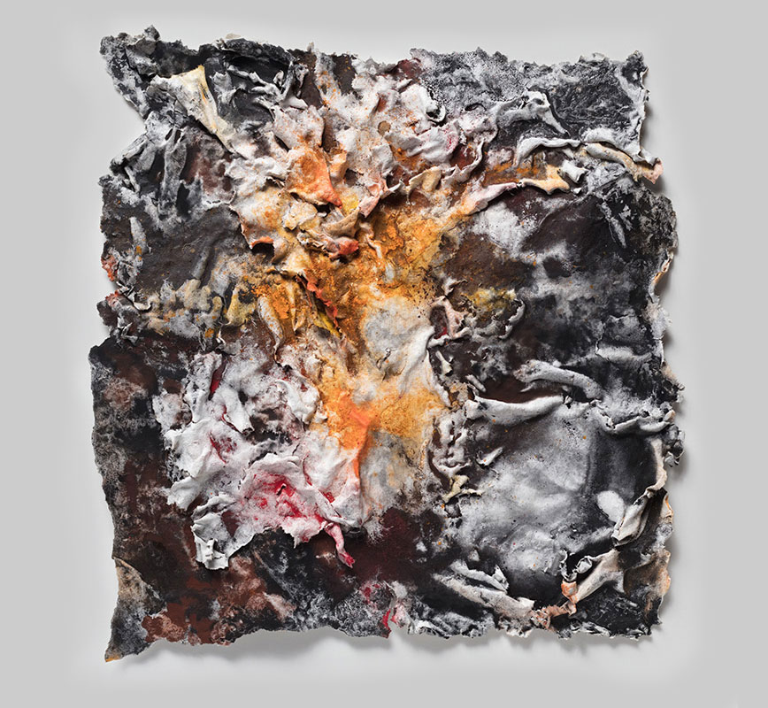 Abstract textural work on paper tridimentionally cast by the artist. Mainly orange and black colors. Title: Flammae Tenebrosae (Fires in the Darkness)