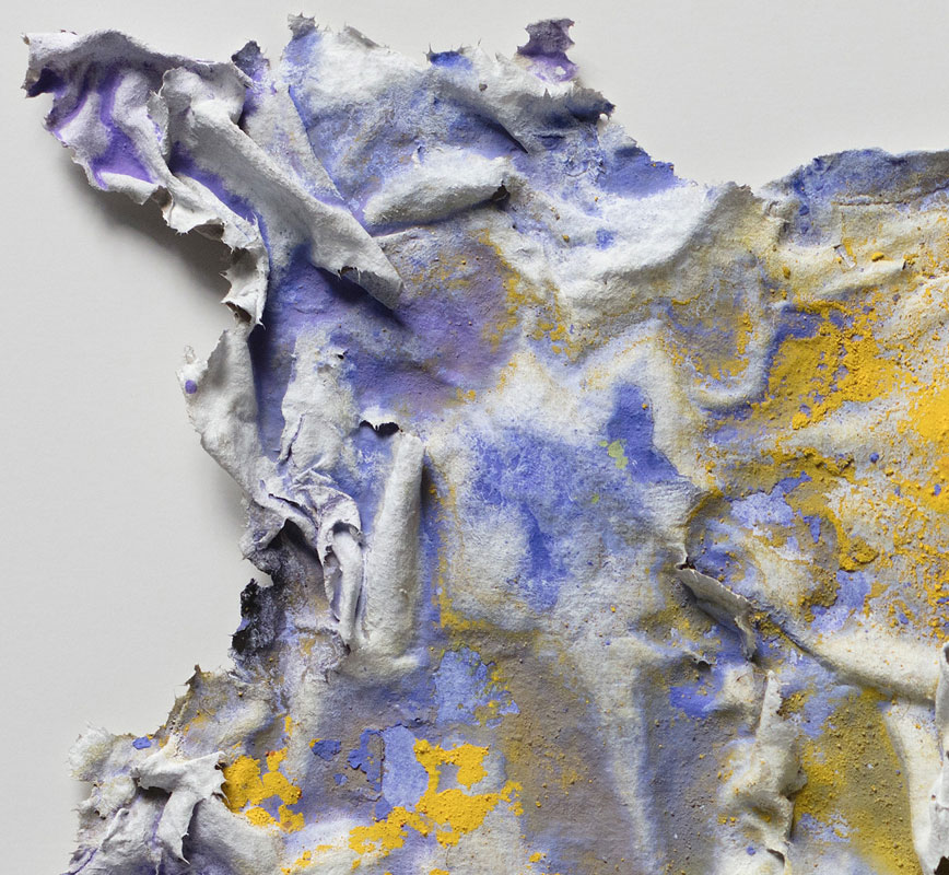 Detail of an abstract textural work on paper tridimentionally cast by the artist. Mainly yellow and blue colors. Title: Aequinoctium Vernum (Spring Equinox)