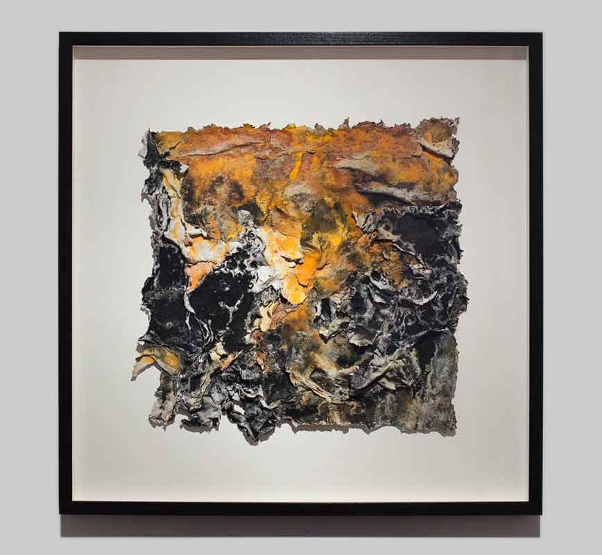Framed abstract textural work on paper tridimentionally cast by the artist. Mainly orange and black colors. Title: Charta: Ater, Gilvus et Flavus