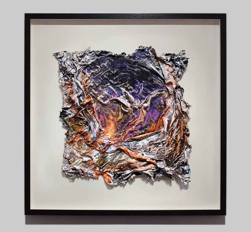 Framed abstract textural work on paper tridimentionally cast by the artist. Mainly purple colors. Title: Charta: Niveus, Luteus et Indicus