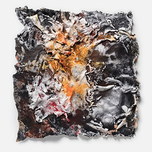 Abstract textural work on paper tridimentionally cast by the artist. Mainly orange and black colors. Title: Flammae Tenebrosae (Fires in the Darkness)