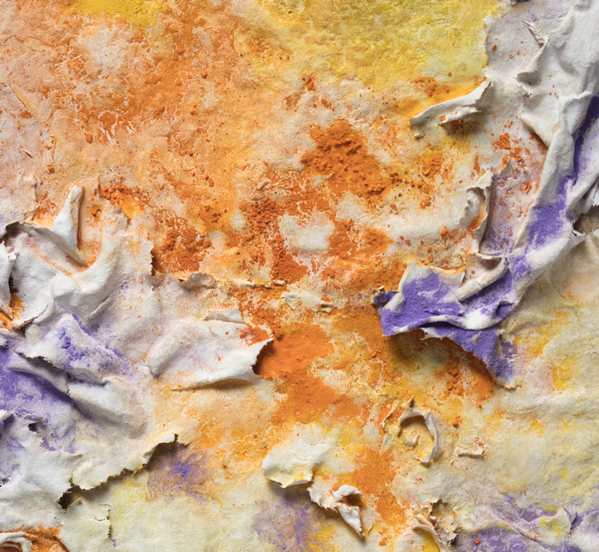Detail of an abstract textural work on paper tridimentionally cast by the artist. Mainly yellow, orange, and purple colors. Title: Solstitium (Summer Solstice)