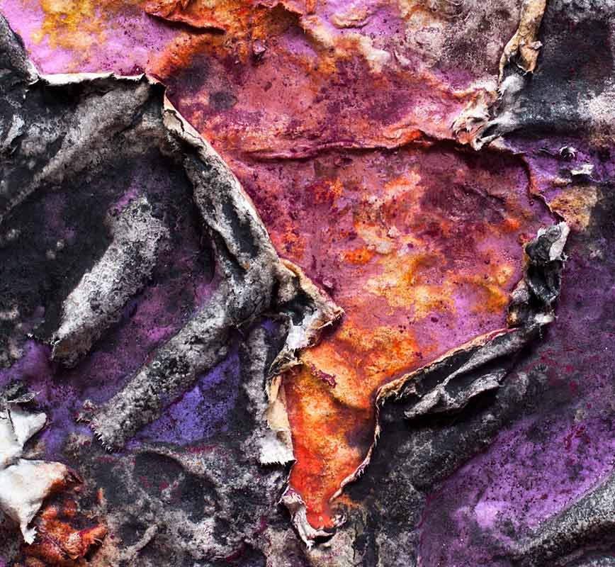 Detail of an abstract textural work on paper tridimentionally cast by the artist. Mainly purple colors. Title: Charta: Ater et Indicus