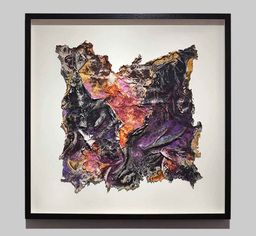 Framed abstract textural work on paper tridimentionally cast by the artist. Mainly purple colors. Title: Charta: Ater et Indicus
