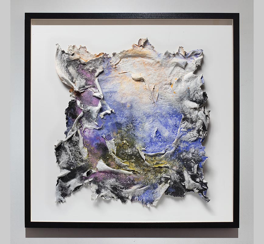 Framed abstract textural work on paper tridimentionally cast by the artist. Mainly blue and black colors. Title: Brumalis Dies (Winter Solstice)