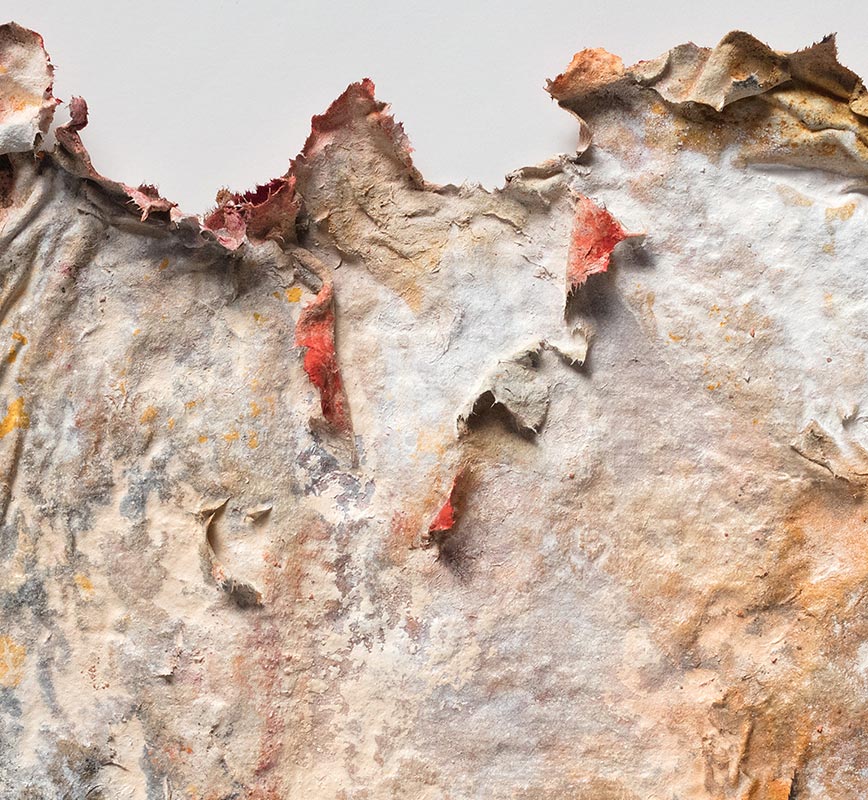 Detail of an abstract textural work on paper tridimentionally cast by the artist. Mainly orange and brown colors. Title: Aequinoctium Autumnale (Fall Equinox)